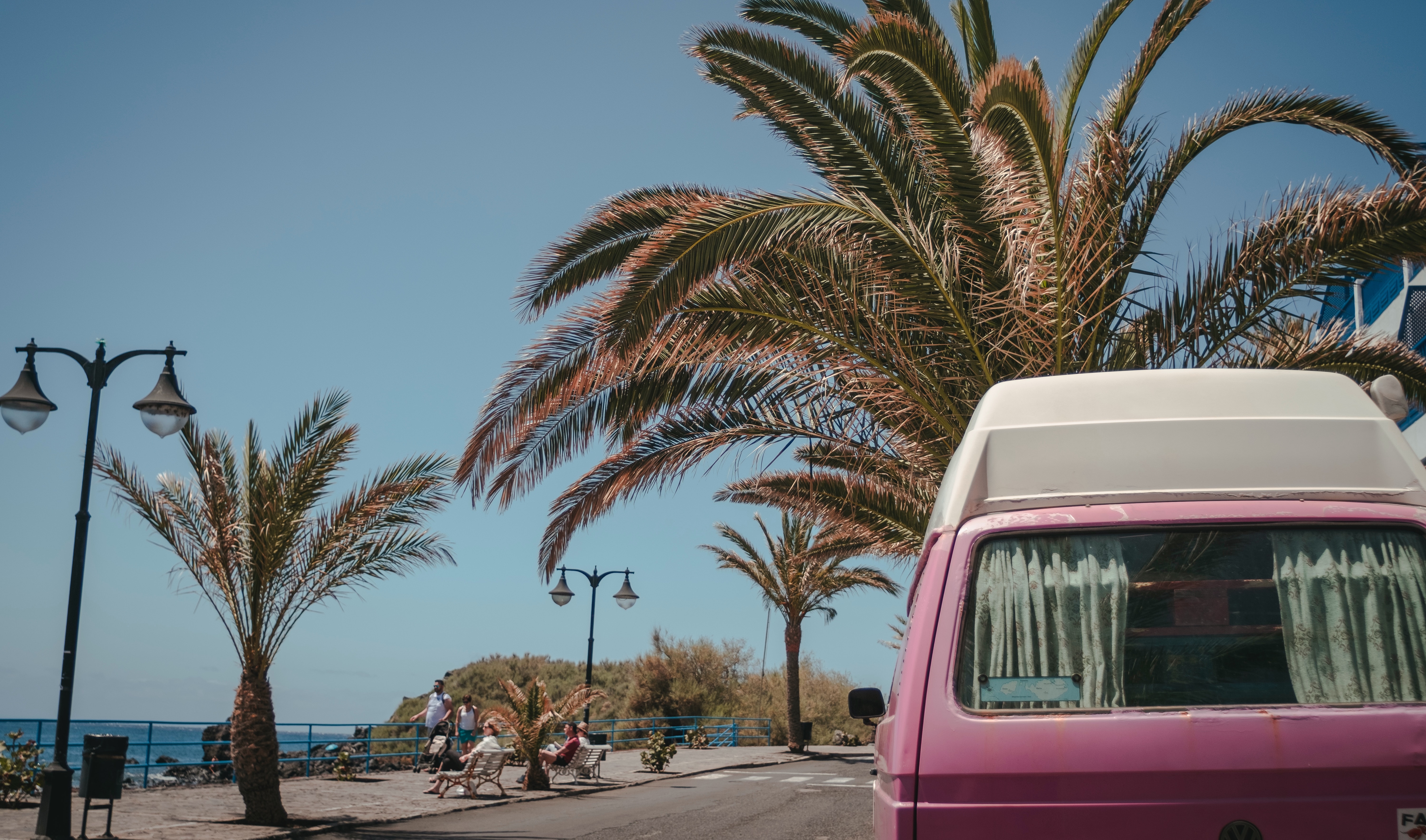 A Volkswagen van on the beach on film.